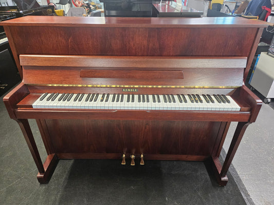 Image of a Kemble upright piano with a refinished mahogany cabinet.